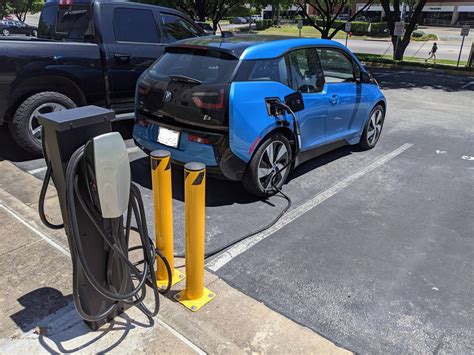 Can I charge my BMW at a Tesla station?